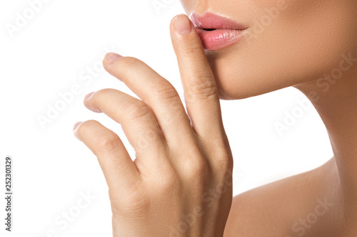 Female lips and hand on white background