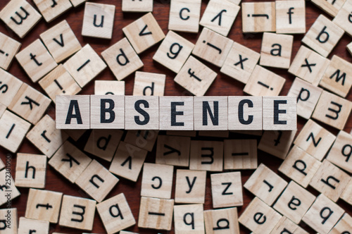 absence word on building block photo