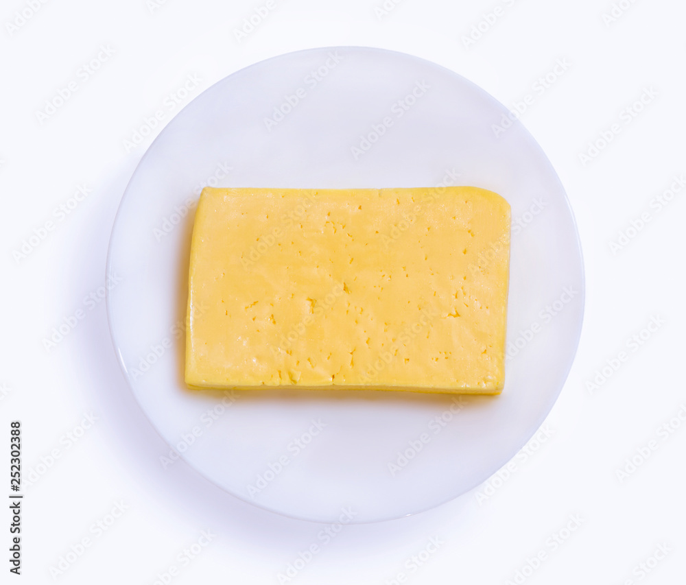 Cheese in a plate on a white background Cheese in a plate on a white background