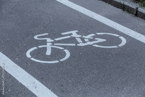 Bicycle path with a bicycle symbol on the asphalt