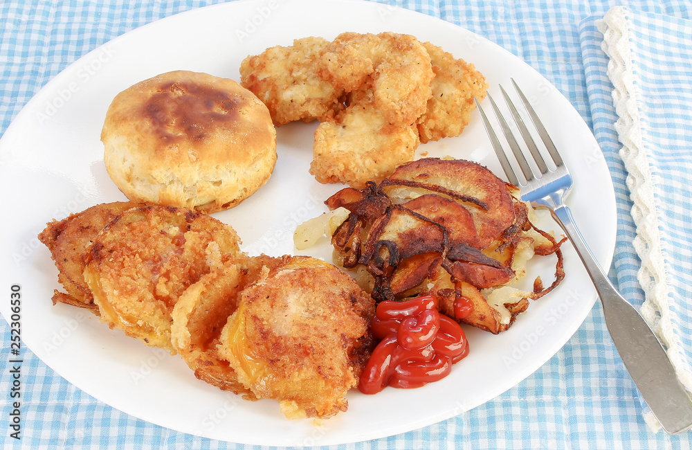 High Cholesterol Meal of Fried Green Tomatoes with Chicken and Home Fries High Cholesterol Meal of Fried Green Tomatoes with Chicken and Home Fries