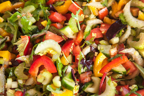 Mixed salad  with  red and yellow  pepper,cabbage ,tomatoes and onion.Vegetarian diet.Background.