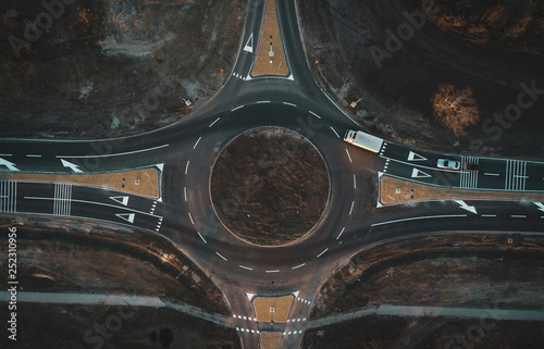 aerial view of cars are moving through a newly built traffic circle © blanke1973