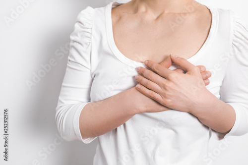 Wallpaper Mural Chest pain in a woman. The concept of heart disease. Mammary cancer.  Torontodigital.ca