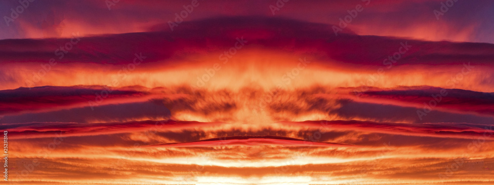 dramatic bright purple red sunset with bright clouds