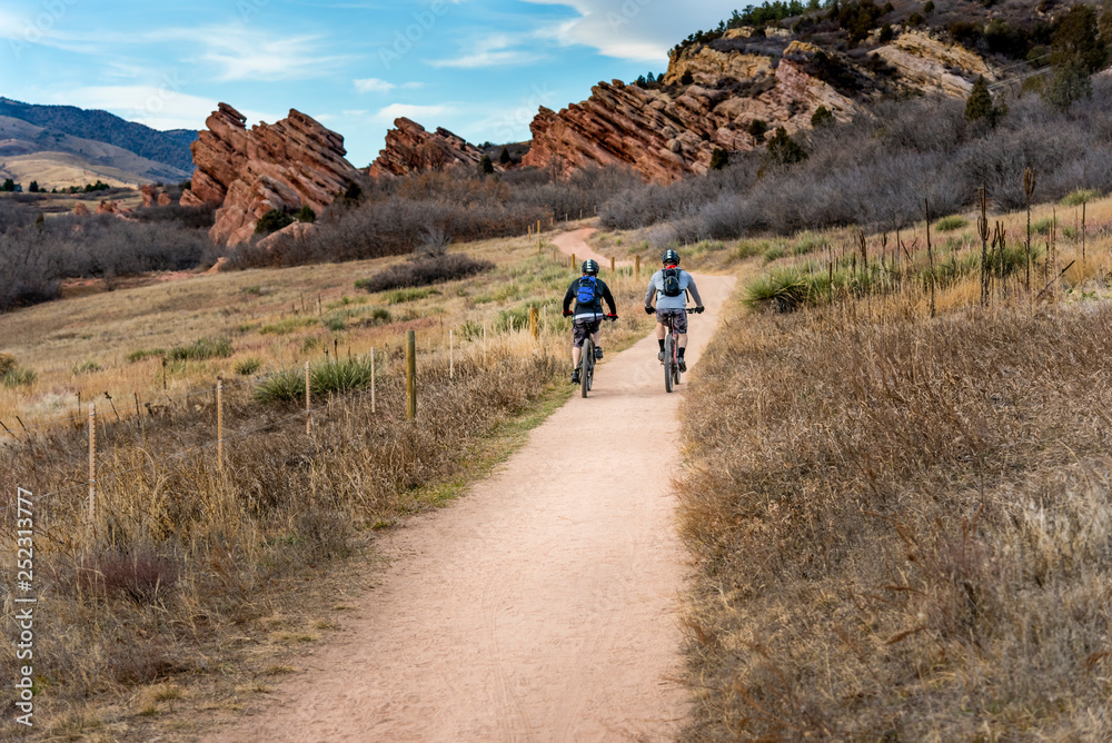 Two mountain bikers exercising on bike trail