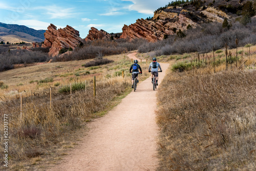 Two mountain bikers exercising on bike trail