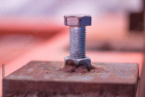 Bolt partially into the mounting nut
