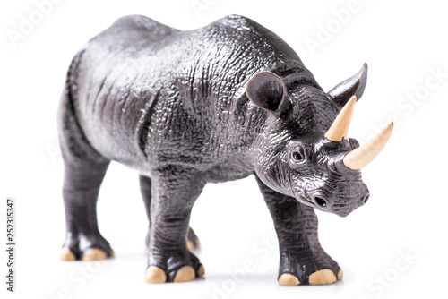 Rhino plastic figurine on white background