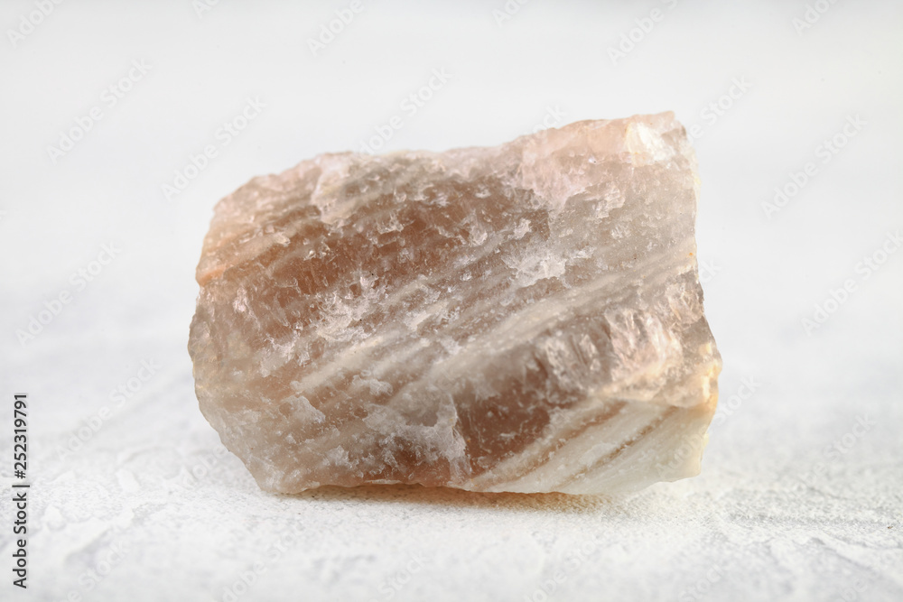Natural mineral - Polychrome fluorite from Transbaikalia, Russia on white cement background. Natural mineral - Polychrome fluorite from Transbaikalia, Russia on white cement background.