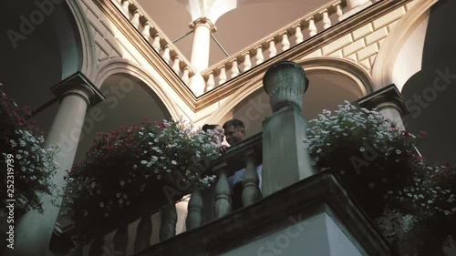 couple kissing on the balcony