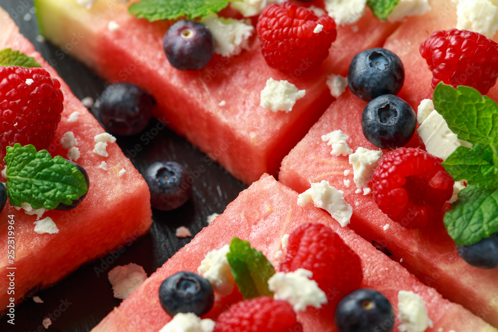 Juicy watermelon pizza with blueberries, raspberry feta cheese, mint. party food Juicy watermelon pizza with blueberries, raspberry feta cheese, mint. party food
