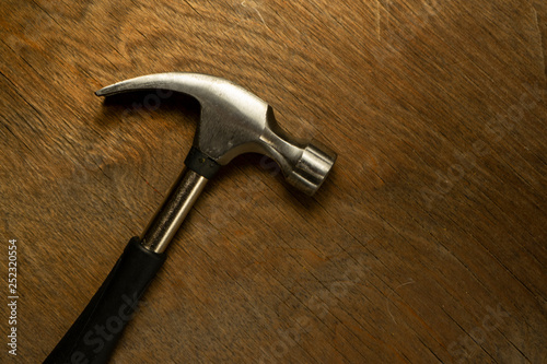  hammer on wood background