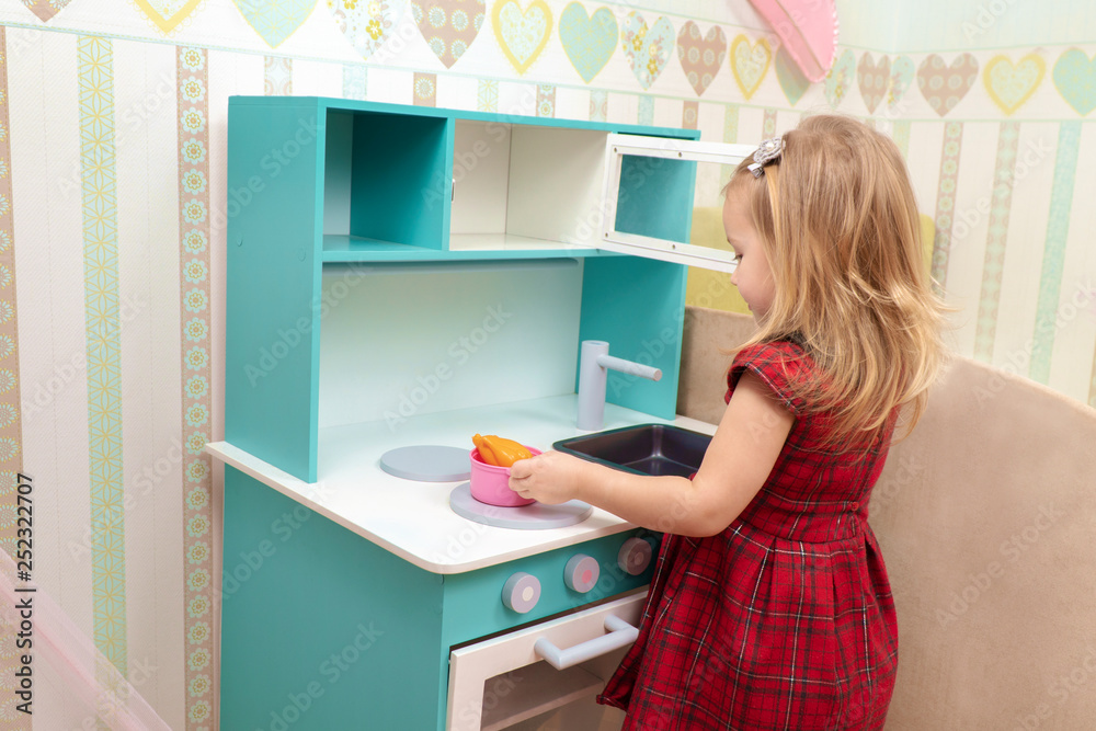 baby cooks on a toy stove baby cooks on a toy stove