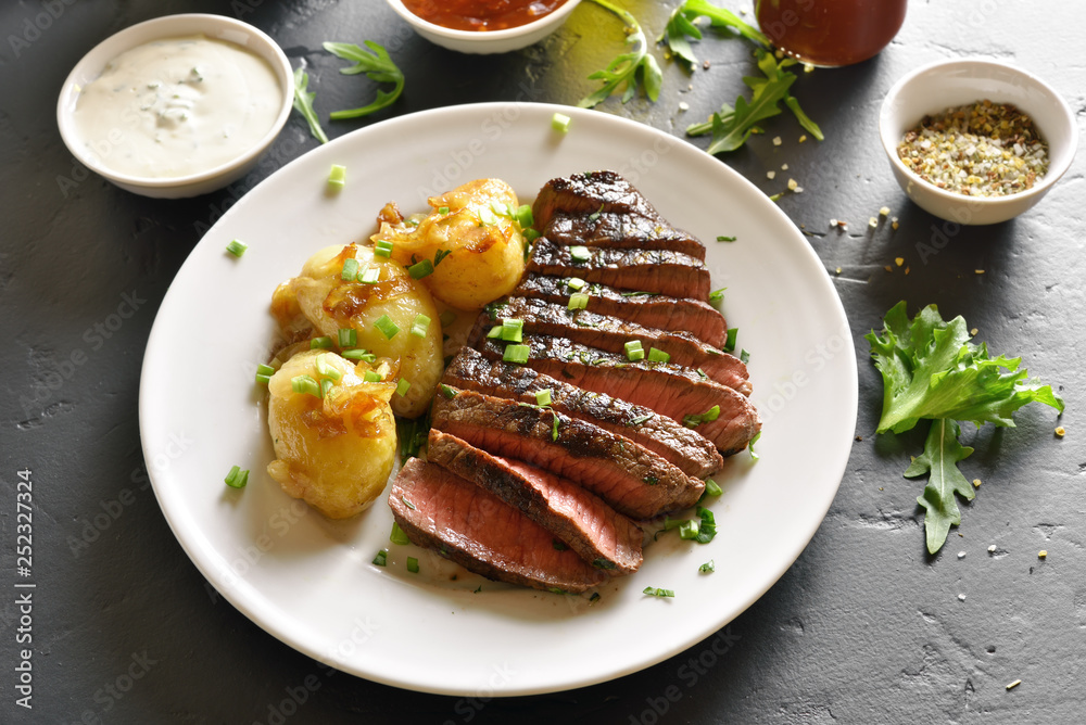 Sliced medium rare roast beef with potato Sliced medium rare roast beef with potato