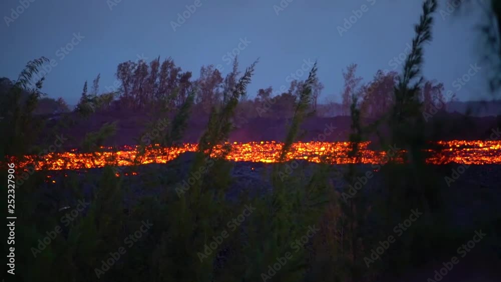 2018 - The Kilauea Volcano on the big island of Hawaii erupting at night with huge lava flows.