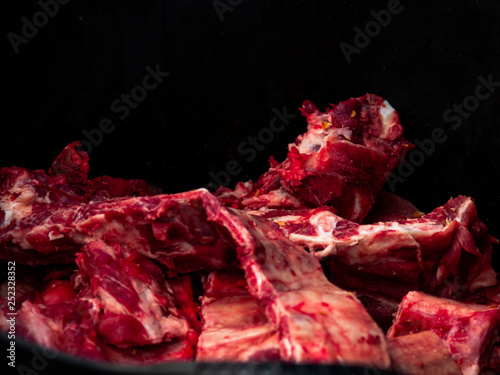 A raw pork rib isolated with black background Poster Mural XXL