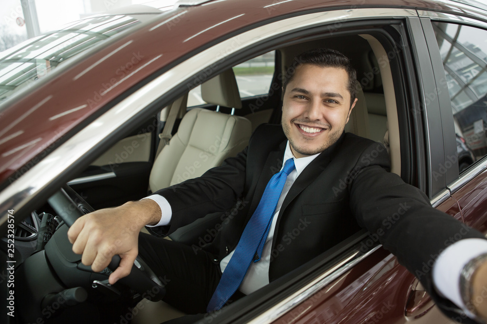 Happy male driver making a selfie in his car Happy male driver making a selfie in his car