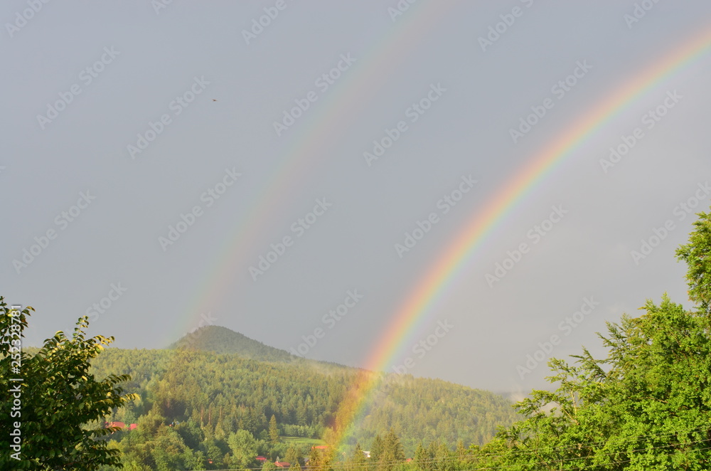 Rainbow in mountains.