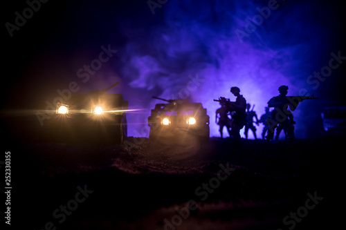 War Concept. Military silhouettes fighting scene on war fog sky background  Fighting silhouettes Below Cloudy Skyline At night. Battle scene. Army vehicle with soldiers. army