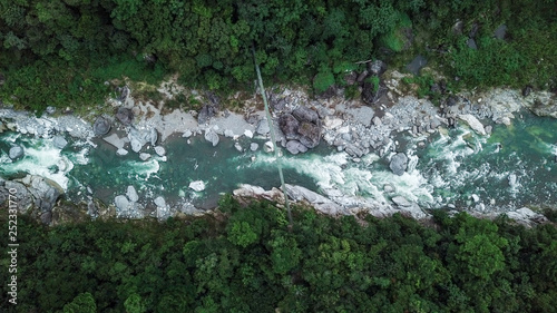Bild auf Leinwand Suspension bridge over Rio Cangrejal river in Pico Bonito National Park