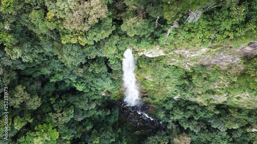 Bejuco Falls Waterfall in Pico Bonito National Park in Honduras. Top down aerial drone photo from above. Tall, big waterfall in the jungle. Dramatic, powerful.