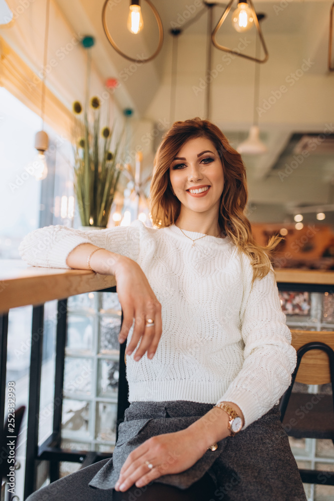 Close up portrait of young hipster modern brunette girl in cafe indoors Close up portrait of young hipster modern brunette girl in cafe indoors
