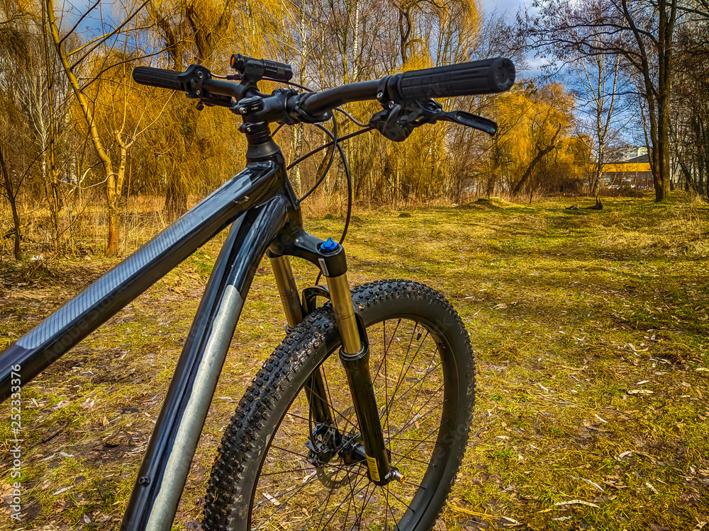 MTB bicycle on the trail in the spring season MTB bicycle on the trail in the spring season