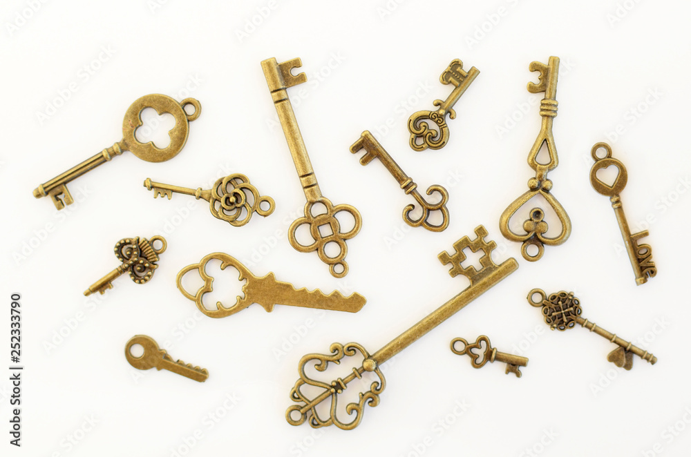 Decorative keys of different sizes, stylized antique on a white background. Form the centerpiece.