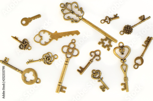 Decorative keys of different sizes, stylized antique on a white background. Form the centerpiece.