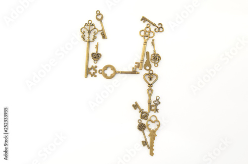 Decorative keys of different sizes, stylized antique on a white background. Form the centerpiece. Numeral