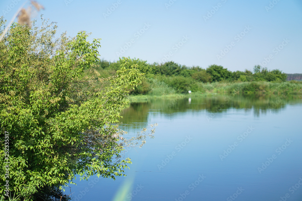 Pretty river in rural areas. European landscape of Russia and Siberia. Beautiful tranquil view of nature. Stock background, photo. Pretty river in rural areas. European landscape of Russia and Siberia. Beautiful tranquil view of nature. Stock background, photo.