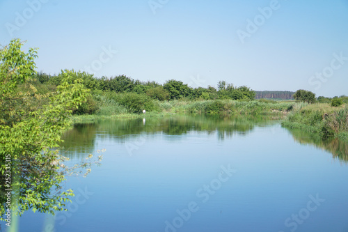 Pretty river in rural areas. European landscape of Russia and Siberia. Beautiful tranquil view of nature. Stock background  photo.