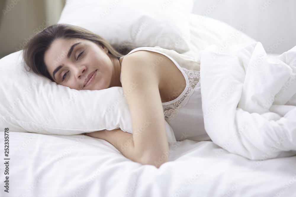 beautiful young woman basking in bed in the morning. Beautiful Model face looks sexy in camera beautiful young woman basking in bed in the morning. Beautiful Model face looks sexy in camera