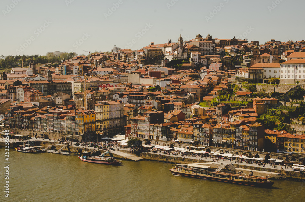 Beautiful Porto cityscape with river and boats