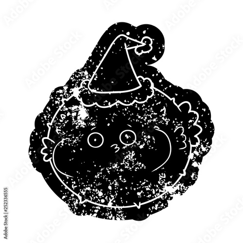cartoon distressed icon of a puffer fish wearing santa hat