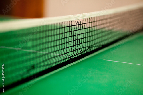 close up ping pong net and line - green table © volody10