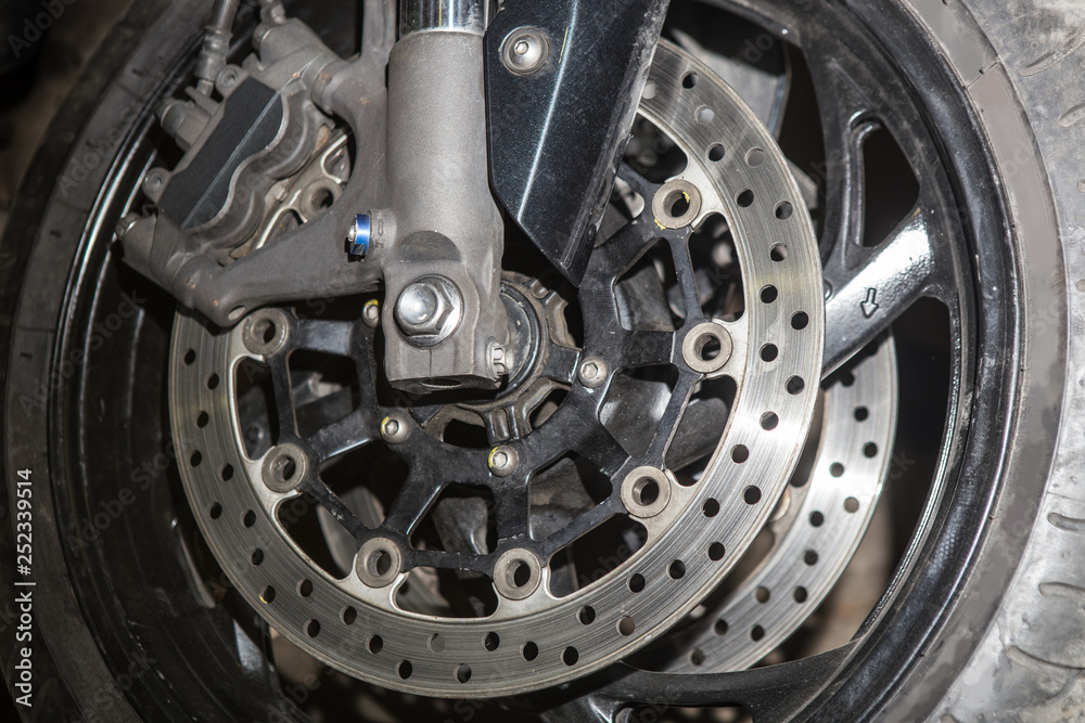 Brake disc on the front wheel of a motorcycle. Brake disc on the front wheel of a motorcycle.