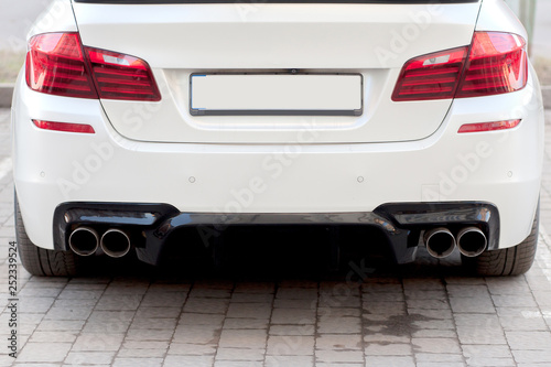 Close up of a car dual exhaust pipe
