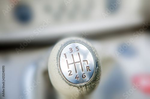 Close-up of Ball shift knob automatic transmission. Closeup car gearbox with blurred background. Switching in six steps and backing