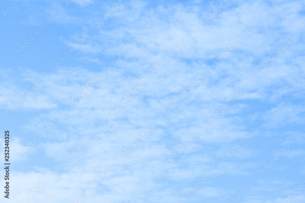 Blue sky with white clouds. Beautiful sky background. Clear day and good weather
