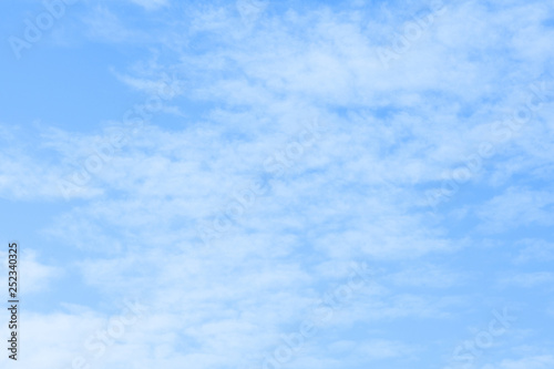 Blue sky with white clouds. Beautiful sky background. Clear day and good weather