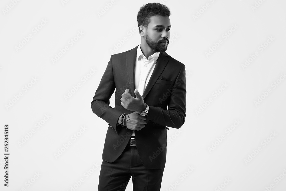 Brutal young African American male model in formal fashion suit Brutal young African American male model in formal fashion suit