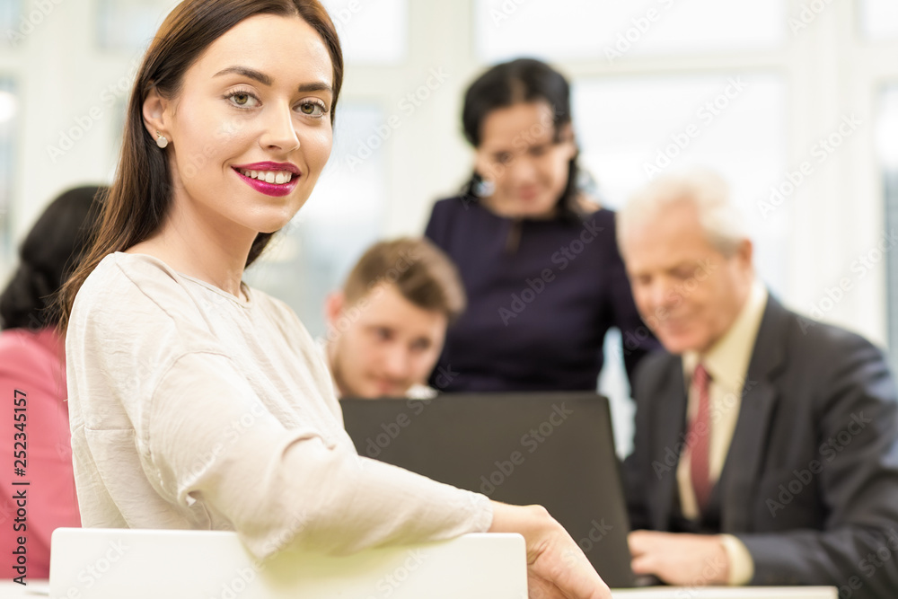 Beautiful businesswoman during the business meeting in a boardroom Beautiful businesswoman during the business meeting in a boardroom