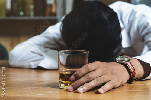 drunkard fall asleep on the table at bar.