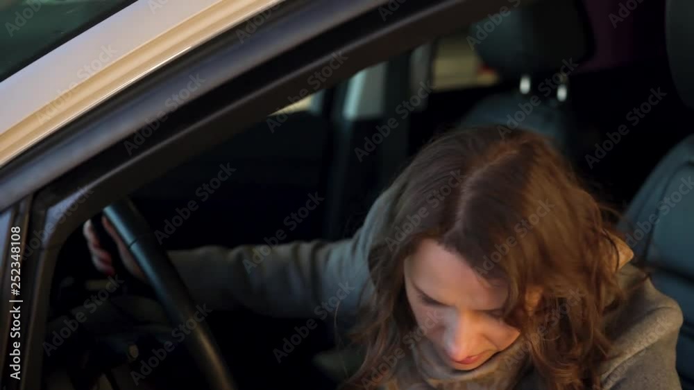 Woman is angry and upset because her car broke down. She gets out of the car Woman is angry and upset because her car broke down. She gets out of the car