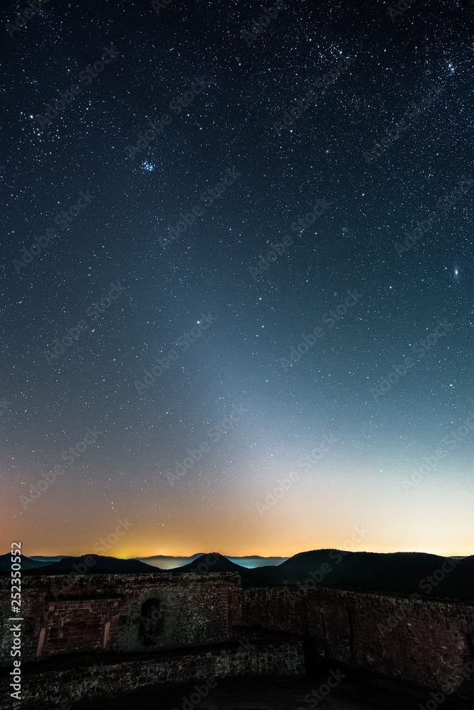 The Zodiacal Light photographed from the Lindelbrunn ruin in the palatinate forest near Vorderweidenthal in Germany.