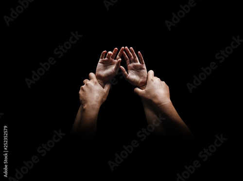 Fotografia, Obraz Man hands holding a woman hands for rape and sexual abuse concept isolated on bl