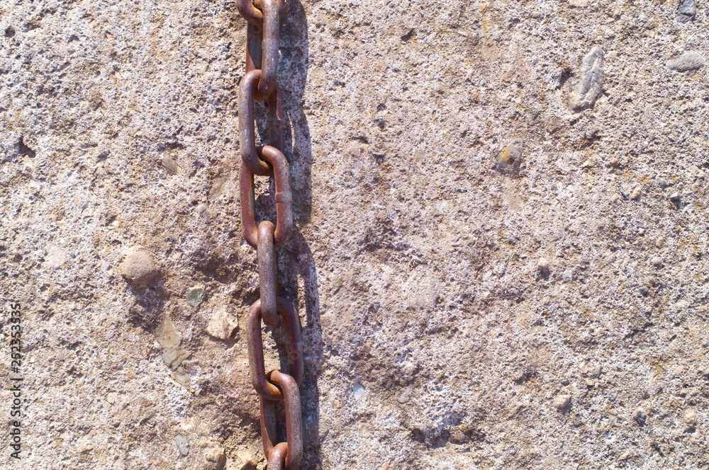 chain and stone wall