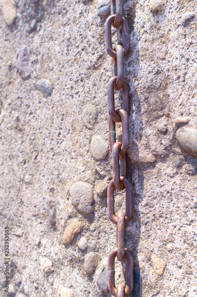 chain and stone wall